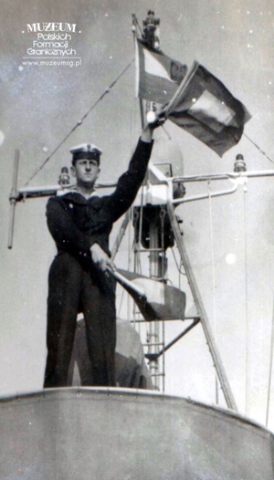 1.Tytuł tematu: marynarz Kaszubskiej Brygady Wojsk Ochrony Pogranicza w czasie egzaminu
2.Opis obrazu: marynarz podczas egzaminu kończącego kurs sygnalisty
3.Data wydarzenia: 31.04.1963 r.
4.Osoby widoczne: mat Andrzej Indrak
5.Hasła przedmiotowe: Wojska Ochrony Pogranicza, kursy 
6.Opis techniczny: 6,5 × 9,5  cm, oryginał, czarnobiałe
7.Autor: brak danych
8.Miejsce przechowywania/właściciel: „Kronika Okrętu Patrolowego WOP - OP-201”, Archiwum Straży Granicznej w Szczecinie